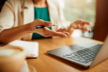 Person talking on a laptop