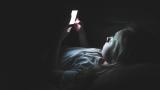 Girl in the dark on a smartphone